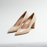Pair of Luna Selene nude block-heeled pumps on a light gray background