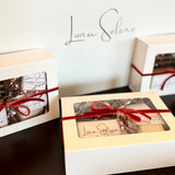 Luxury gift boxes by Luna Selene wrapped with red ribbon for self-care, birthdays, holidays, and thoughtful gifting. 